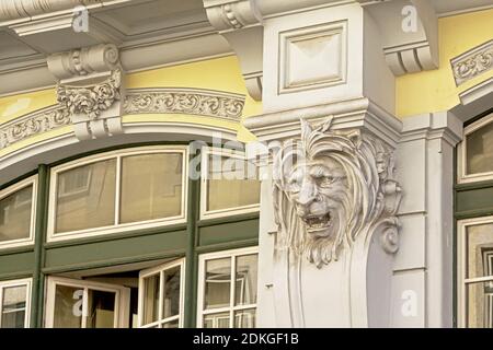 Lion`s head sculpture, detail of an art deco building in Lisbon, Portugal Stock Photo